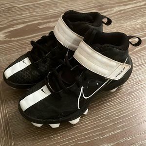 Black and white Nike Trout baseball cleats size 2